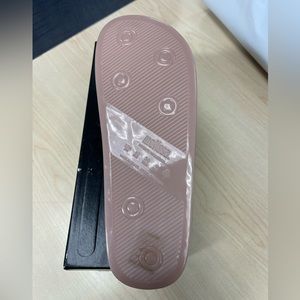 Nude color with floral design on top.